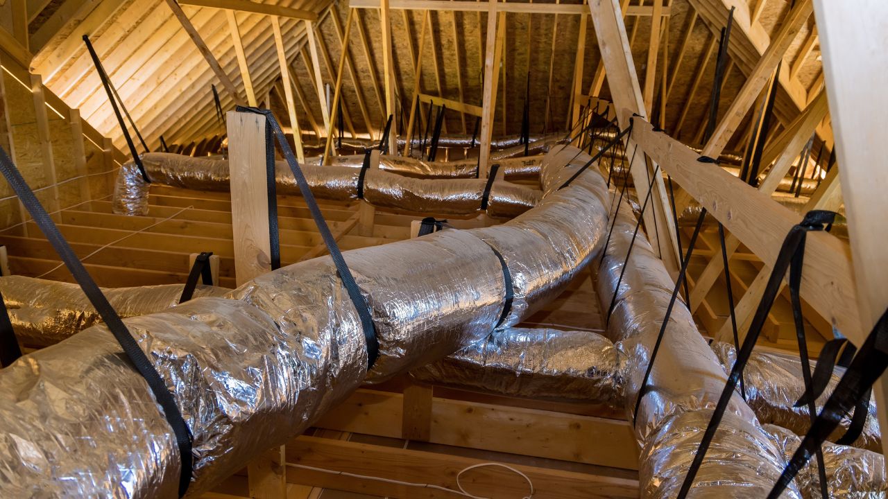 Insulated air ducts running through a home's attic