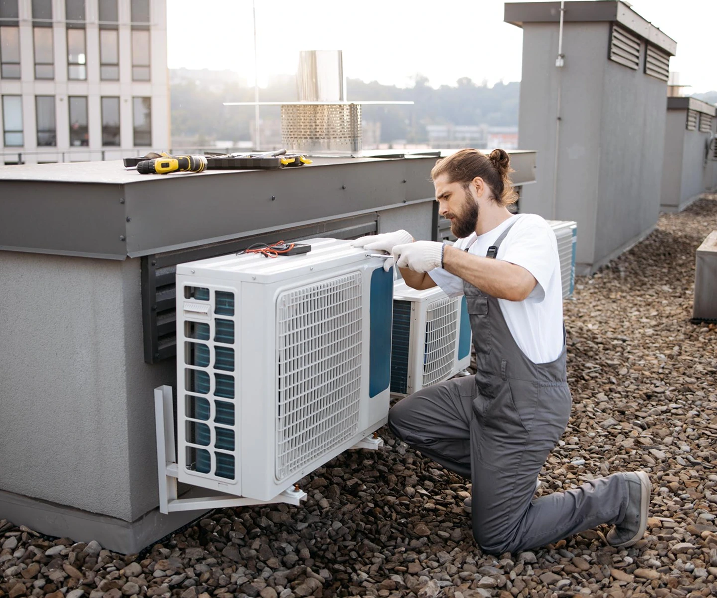 Technician installing an outdoor air conditioning unit